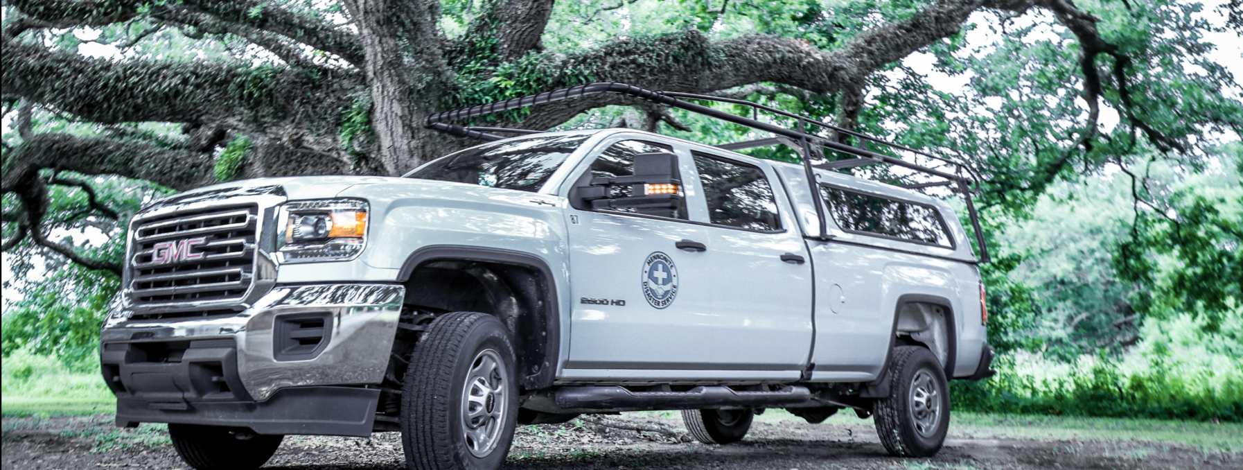 An MDS truck sits under a majestic tree at the Jennings, LA base camp.